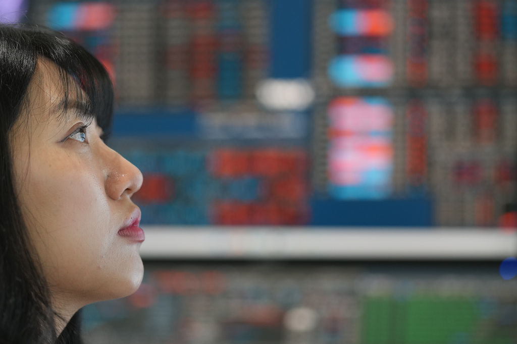 A dealer watches computer monitors at a dealing room of Hana Bank in Seoul, South Korea, Friday, May 15, 2026. (AP Photo/Lee Jin-man)