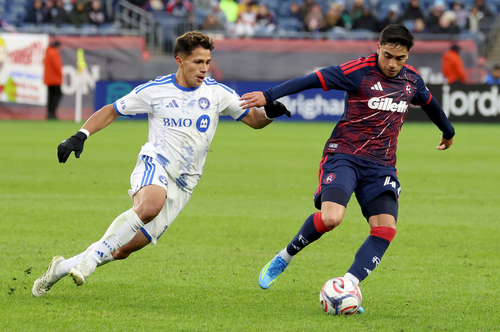 New England Revolution forward Luca Langoni, right, turns away from CF Montréal midfielder Wiki Carmona, left, in the second half of an MLS soccer match Saturday, April 4, 2026, in Foxborough, Mass. (AP Photo/Mark Stockwell)