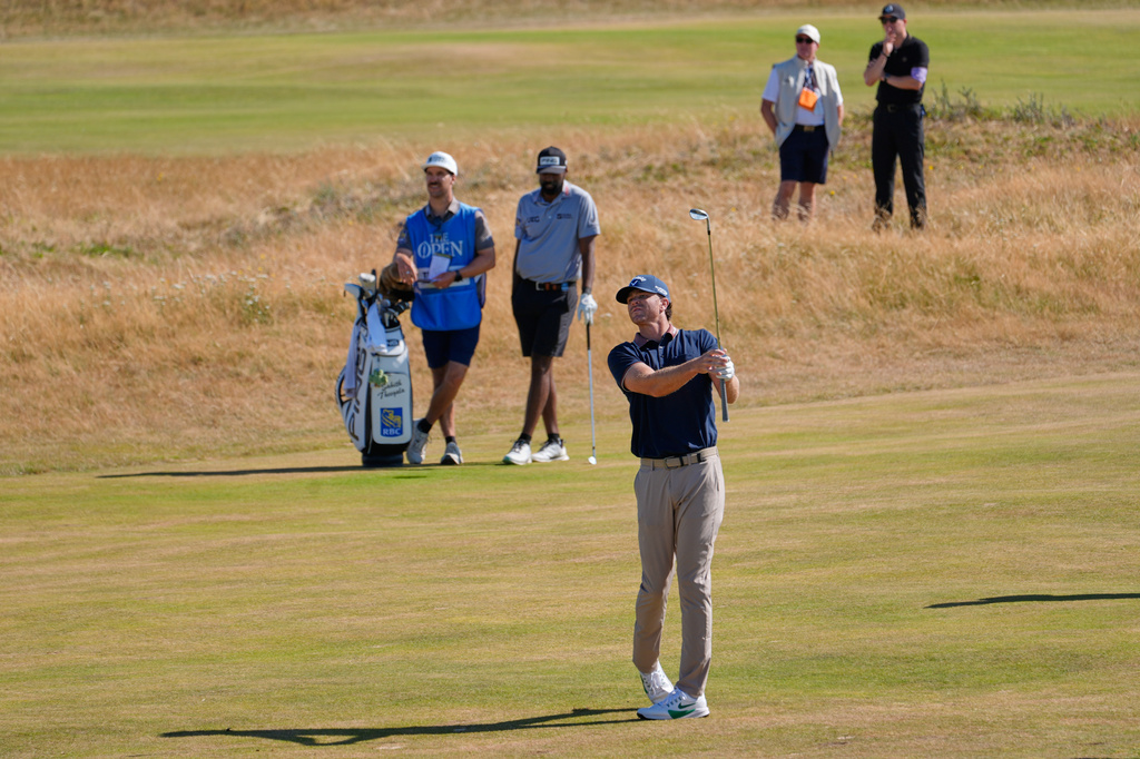Marcus Plunkett of the United States plays a shot on the 11th fairway during a practice round for the British Open Golf championships at Royal Birkdale golf club, in Southport, England, Tuesday, July 14, 2026. (AP Photo/David Goldman)