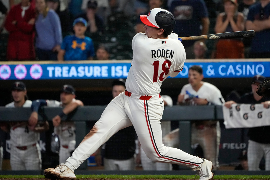 Minnesota Twins' Alan Roden (18) hits a walk-off RBI single scoring Royce Lewis in the ninth inning of a baseball game against the Cleveland Guardians, Wednesday, July 8, 2026, in Minneapolis. (AP Photo/Joseph Scheller)