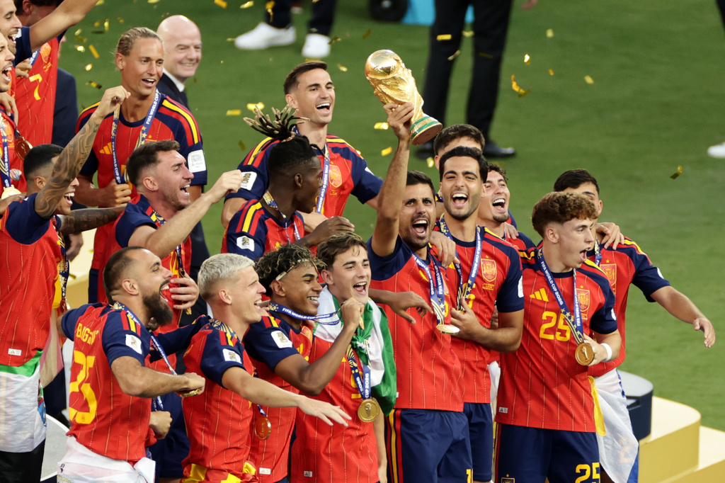 Spain's Rodri celebrates with the trophy after the World Cup final soccer match between Spain and Argentina in East Rutherford, N.J., near New York, Sunday, July 19, 2026. (AP Photo/Adam Hunger)