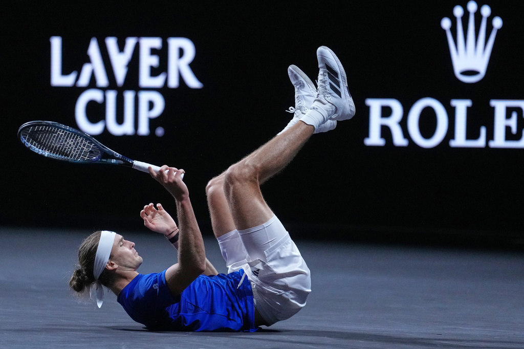 Team Europe's Alexander Zverev slips and falls during a rally against Team World's Alex De Minaur during a Laver Cup tennis tournament match in London, Saturday, Sept. 26, 2026. (AP Photo/Maja Smiejkowska)
