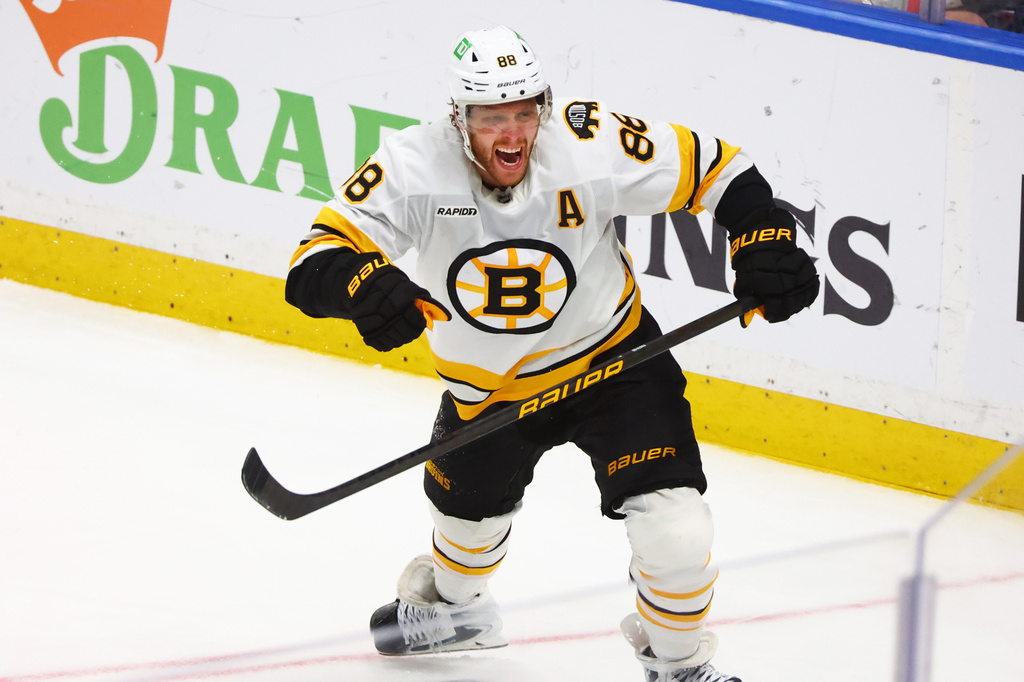 Boston Bruins right wing David Pastrnak (88) celebrates his goal during the overtime period in Game 5 of a first-round NHL hockey Stanley Cup playoff series against the Buffalo Sabres Tuesday, April 28, 2026, in Buffalo, N.Y. (AP Photo/Jeffrey T. Barnes)