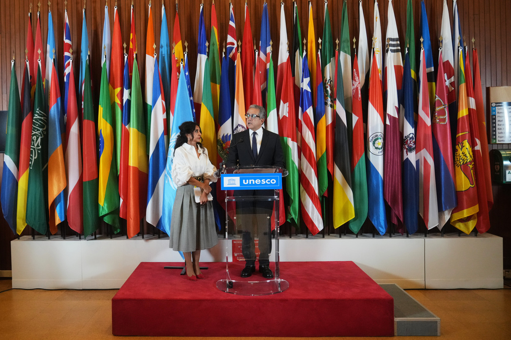 Egypt's Khaled El Enany, right, flanked by President of executive board Vera El Khoury Lacoeuilhe speaks to the press after being elected Secretary-General by UNESCO executive board members, at the UNESCO headquarters in Paris, Monday, Oct. 6, 2025. (AP Photo/Thibault Camus)
