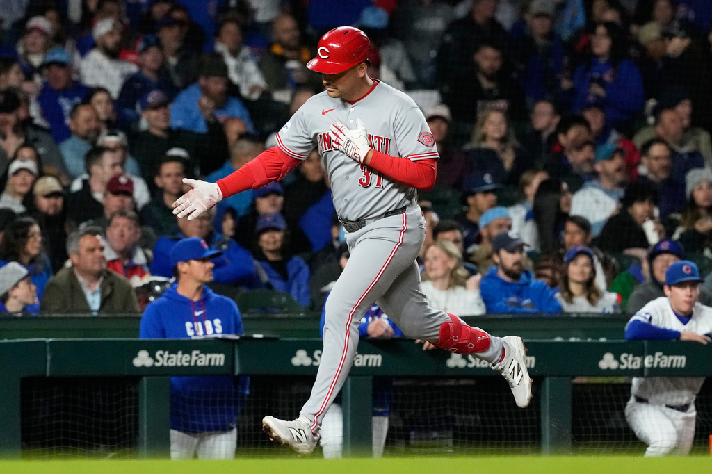 Cincinnati Reds' Nathaniel Lowe celebrates as he rounds the bases after hitting a solo home run during the sixth inning of a baseball game against the Chicago Cubs in Chicago, Tuesday, May 5, 2026. (AP Photo/Nam Y. Huh)