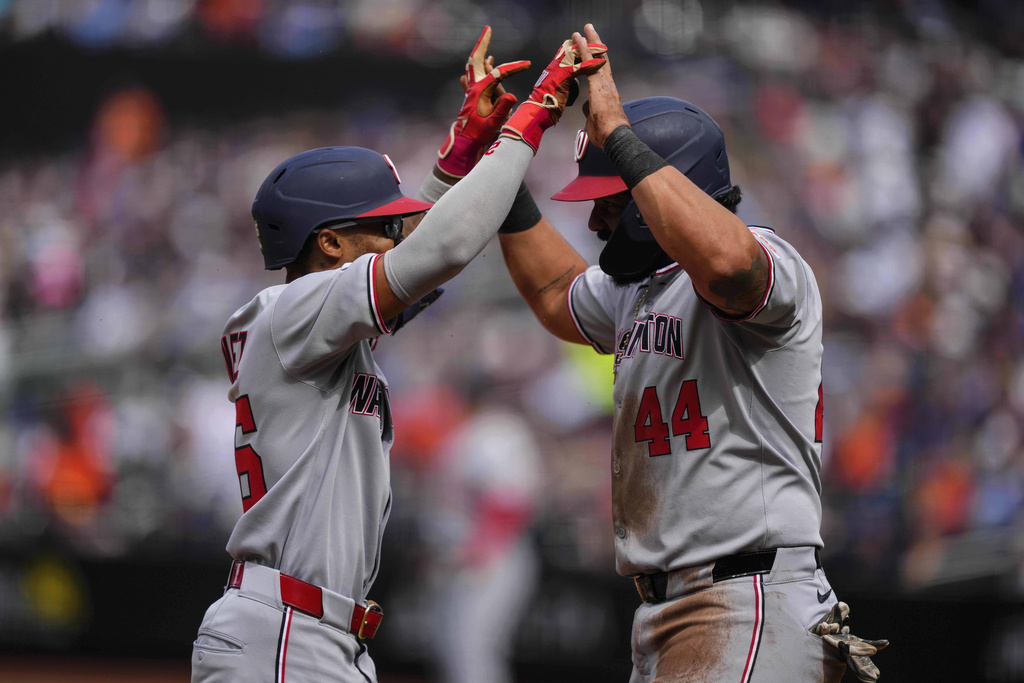 Washington Nationals' Nasim Nuñez (26) celebrates with Washington Nationals' Jorge Alfaro (44) after hitting a two run home run during the second inning of a baseball game against the New York Mets, Sunday, Sept. 21, 2025, in New York. (AP Photo/Yuki Iwamura)