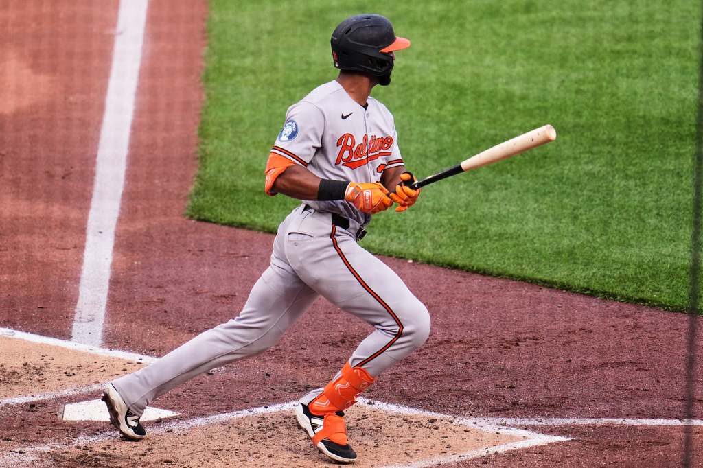 Baltimore Orioles' Leody Taveras singles off Pittsburgh Pirates pitcher Carmen Mlodzinski, driving in a run, during the fourth inning of a baseball game in Pittsburgh, Saturday, April 4, 2026. (AP Photo/Gene J. Puskar)