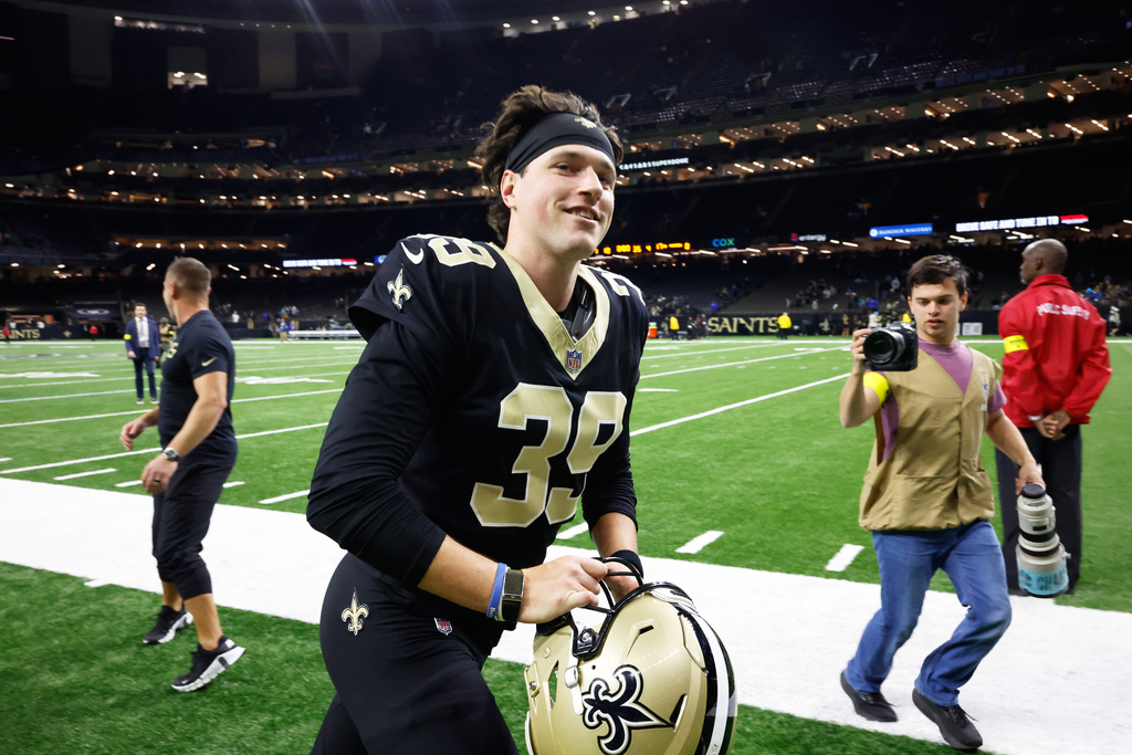 New Orleans Saints placekicker Charlie Smyth (39) runs off the field after an NFL football game against the Carolina Panthers, Sunday, Dec. 14, 2025, in New Orleans. (AP Photo/Butch Dill)