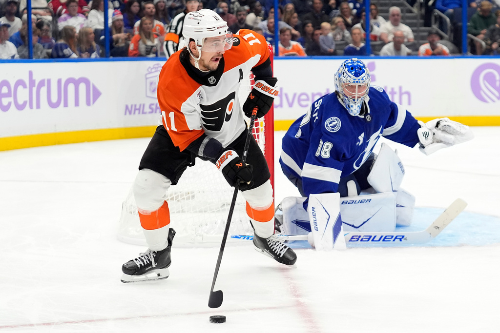 Philadelphia Flyers right wing Travis Konecny (11) looks to pass in front of Tampa Bay Lightning goaltender Andrei Vasilevskiy (88) during the third period of an NHL hockey game Monday, Nov. 24, 2025, in Tampa, Fla. (AP Photo/Chris O'Meara)