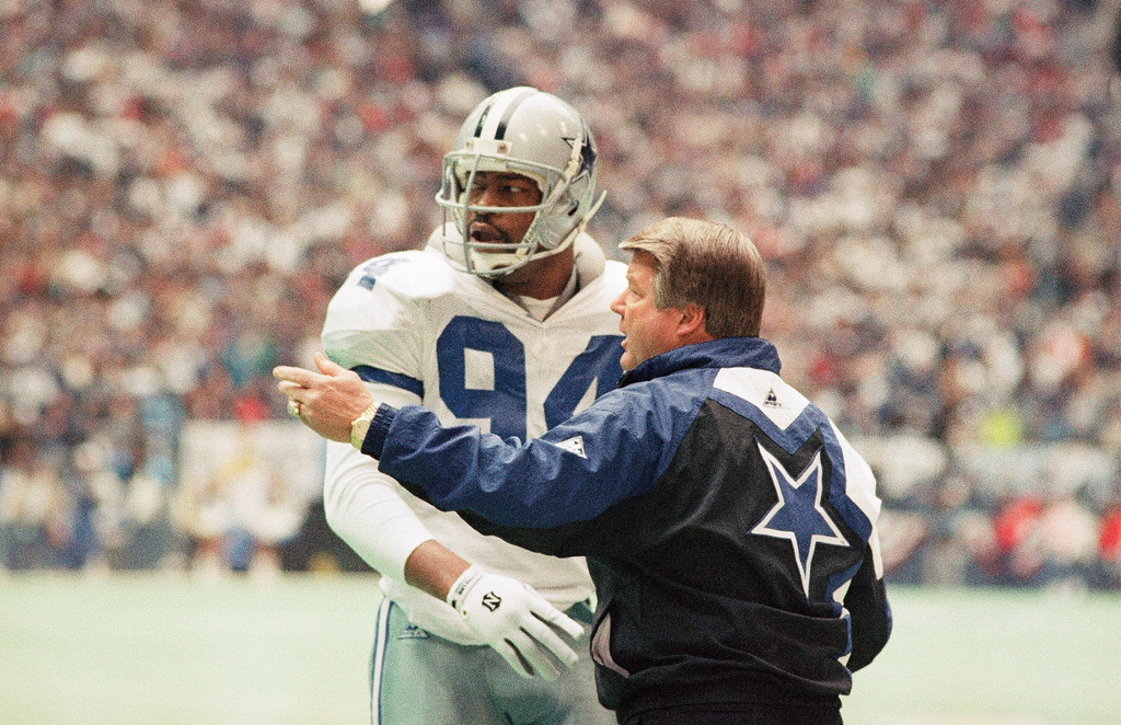 FILE - Dallas Cowboys' coach Jimmy Johnson, right confers with defensive end Charles Haley in the first half of their NFC championship game against the San Francisco 49ers, Jan. 23, 1994, in Irving, Texas. (AP Photo/Linda Kaye, File)