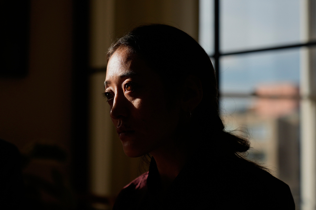 Namkyi, a Tibetan former political prisoner who was arrested at 15 and imprisoned for protesting Chinese rule, recounts her story during a meeting with staff at Vital Voices, a non-profit organization, Oct. 7, 2025, in Washington. (AP Photo/David Goldman)