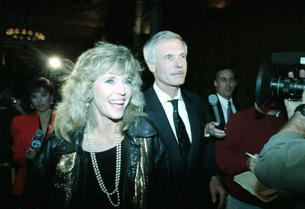 FILE - Actress and political activist Jane Fonda and media mogul Ted Turner arrive at a party in support of Proposition 128 in Los Angeles on Nov. 6, 1990. (AP Photo/Reed Saxon, File)