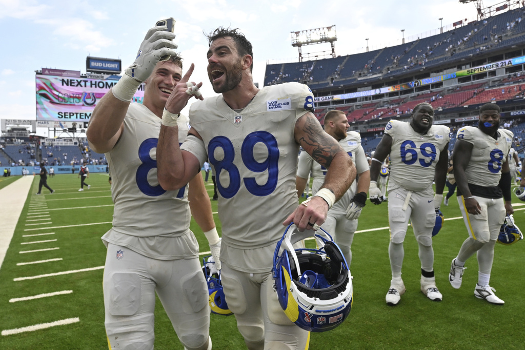 Los Angeles Rams tight end Davis Allen, left, and tight end Tyler Higbee celebrate after the Rams defeated the Tennessee Titans in an NFL football game Sunday, Sept. 14, 2025, in Nashville, Tenn. (AP Photo/John Amis)