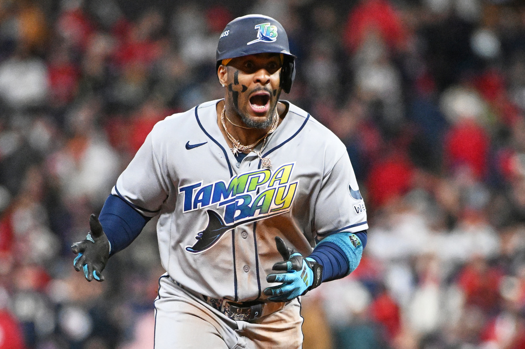 Tampa Bay Rays' Yandy D&iacute;az celebrates a two-run home run against the Cleveland Guardians during the ninth inning in Game 4 of an American League Championship Series baseball game in Cleveland, Saturday, Oct. 17, 2026. (AP Photo/Phil Long)