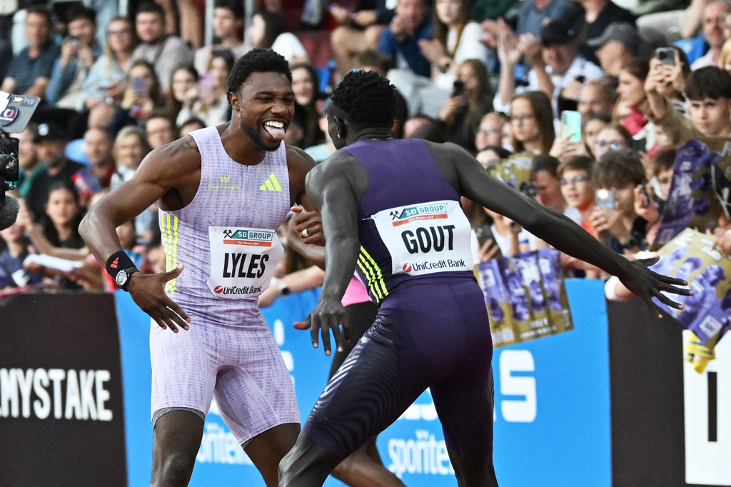 Noah Lyles of United States celebrates with Gout Gout of Australia after winning the men's 150 meters event at the Golden Spike athletics meeting in Ostrava, Czech Republic, Tuesday, June 16, 2026. (AP Photo/Lukas Kabon)