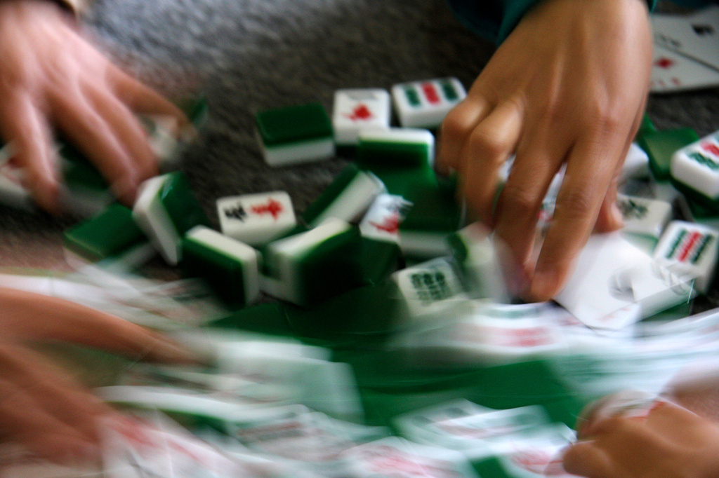 FILE - Mahjong tiles are shuffled during a game in Beidian, China, on Nov. 16, 2008. (AP Photo/Audra Ang, File)