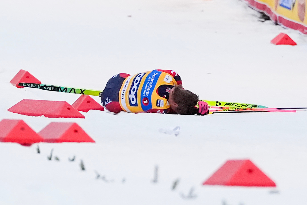 Norway's Johannes Hoesflot Klaebo lies on the snow after a fall during the World Cup sprint cross-country race in Drammen, Norway, Thursday March 12, 2026. (Lise Aserud/NTB Scanpix via AP)