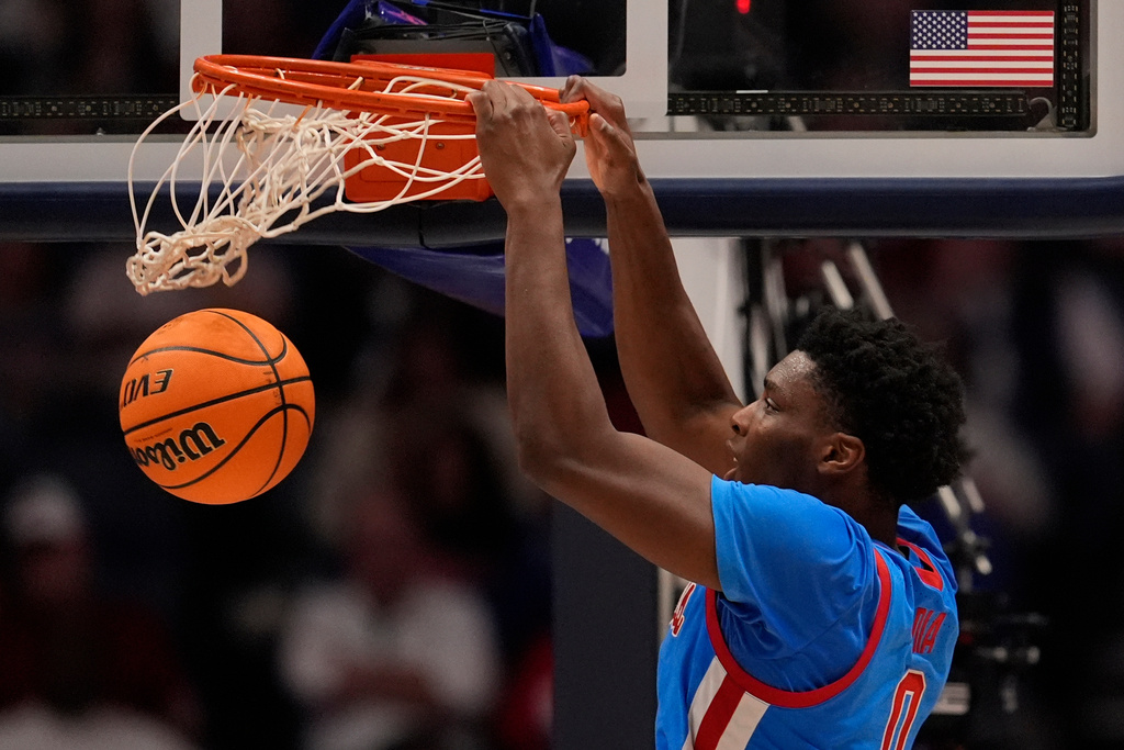Mississippi forward Malik Dia (0) dunks against Alabama during the second half of an NCAA college basketball game in the quarterfinal round of the Southeastern Conference tournament, Friday, March 13, 2026, in Nashville, Tenn. (AP Photo/George Walker IV)