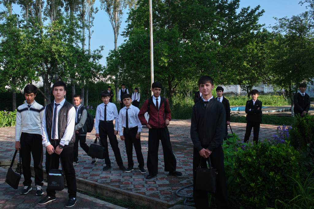 Students pose for a photo outside their school in Istaravshan, Tajikistan, Monday, May 4, 2026. (AP Photo/Jon Orbach)