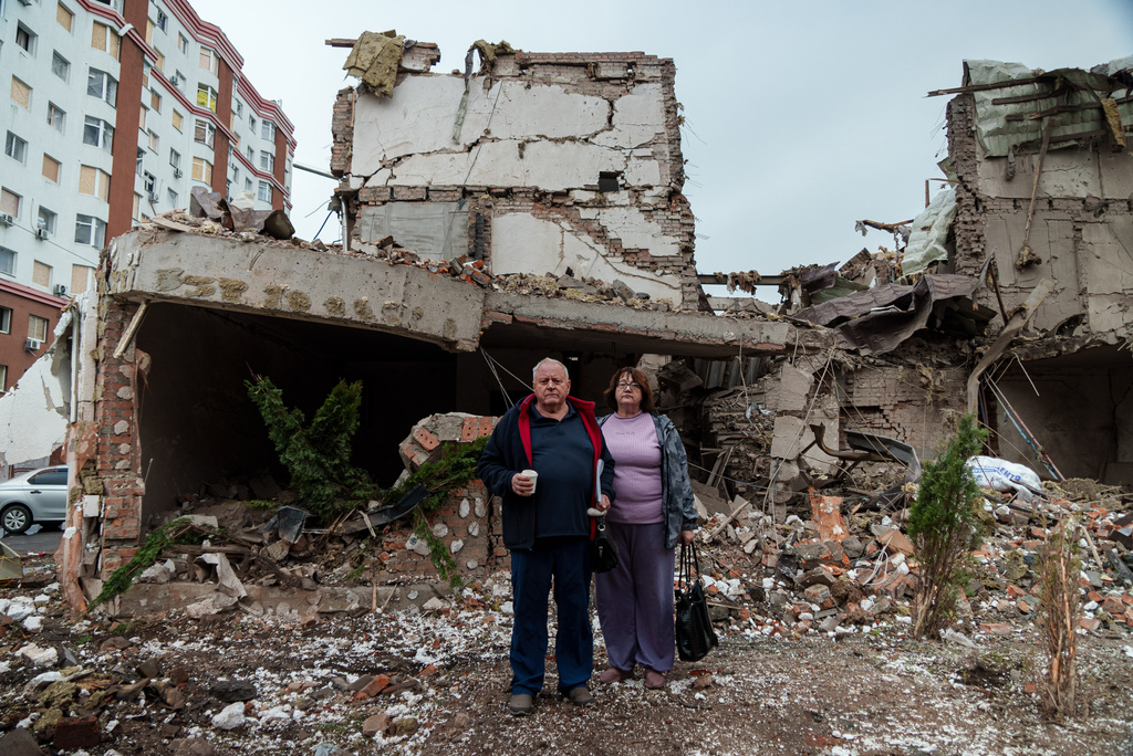 Mykola Pastukh, 67, with his wife Oksana Pastukh, 58, stand next to their house destroyed in a Russian attack in Kyiv, Ukraine, on Monday, Sept. 29, 2025. (AP Photo/Vasilisa Stepanenko)
