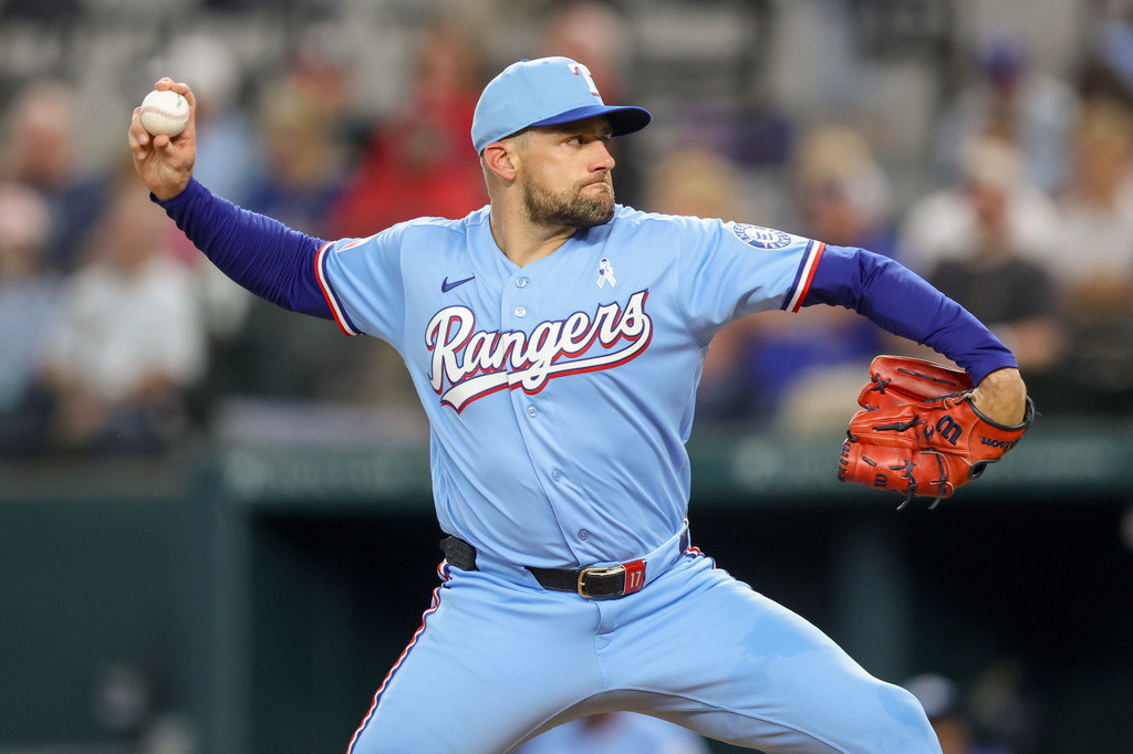 Texas Rangers pitcher Nathan Eovaldi (17) delivers the pitch during a baseball game against the San Diego Padres, Sunday, June 21, 2026, in Arlington, Texas. (AP Photo/Gareth Patterson)