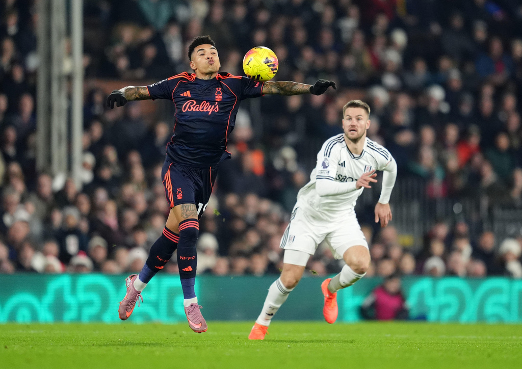 Nottingham Forest's Igor Jesus and Fulham's Joachim Andersen, right, battle for the ball during the Premier League match between NottinghamForest and Fulham, in London, Monday Dec. 22, 2025. (Adam Davy/PA via AP)