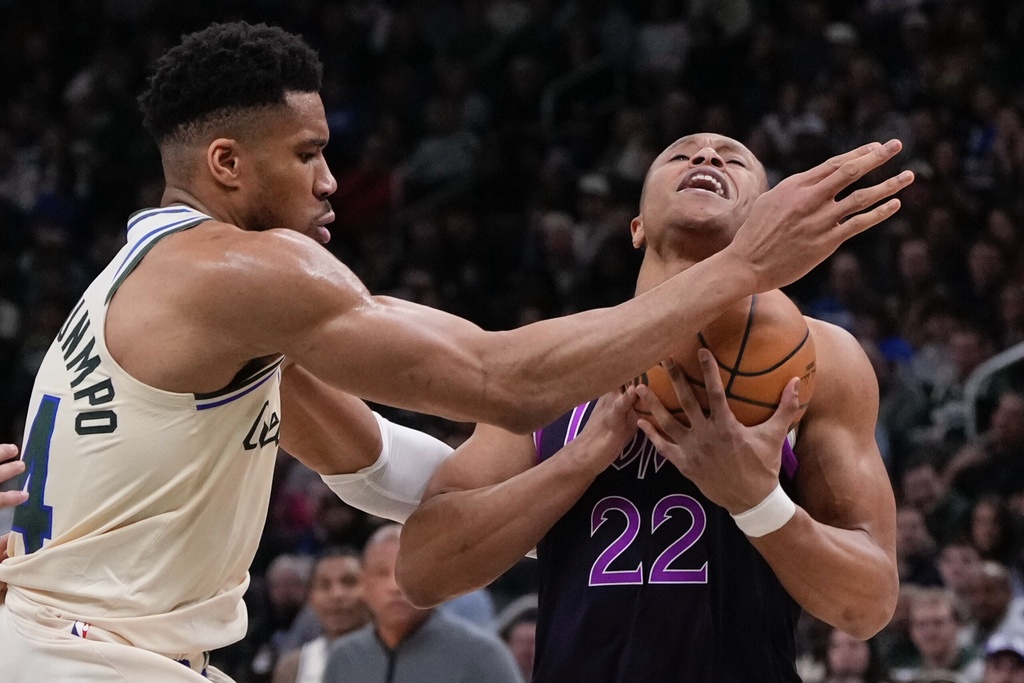 Milwaukee Bucks' Giannis Antetokounmpo fouls Minnesota Timberwolves' Jaylen Clark during the first half of an NBA basketball game Tuesday, Jan. 13, 2026, in Milwaukee. (AP Photo/Morry Gash)