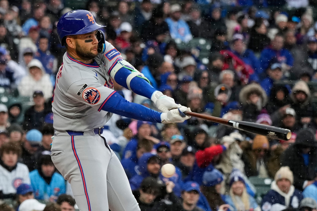 New York Mets' Bo Bichette strikes out swinging during the first inning of a baseball game against the Chicago Cubs in Chicago, Sunday, April 19, 2026. (AP Photo/Nam Y. Huh)