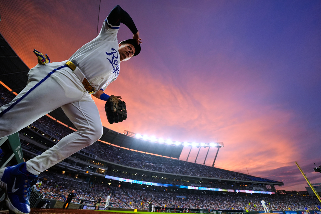 Kansas City Royals left fielder Isaac Collins runs onto the field during the sixth inning of a baseball game against the Philadelphia Phillies, Saturday, July 4, 2026, in Kansas City, Mo. (AP Photo/Charlie Riedel)