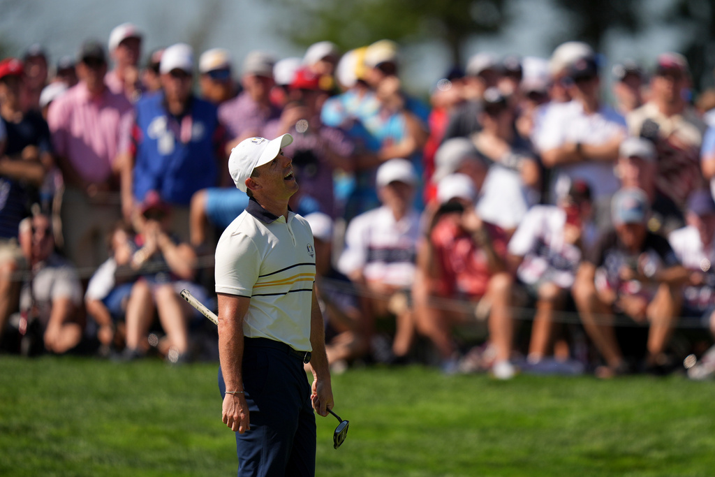 Europe's Rory McIlroy reacts after missing a putt on the fourth hole during their singles match on the Bethpage Black golf course at the Ryder Cup golf tournament, Sunday, Sept. 28, 2025, in Farmingdale, N.Y. (AP Photo/Seth Wenig)