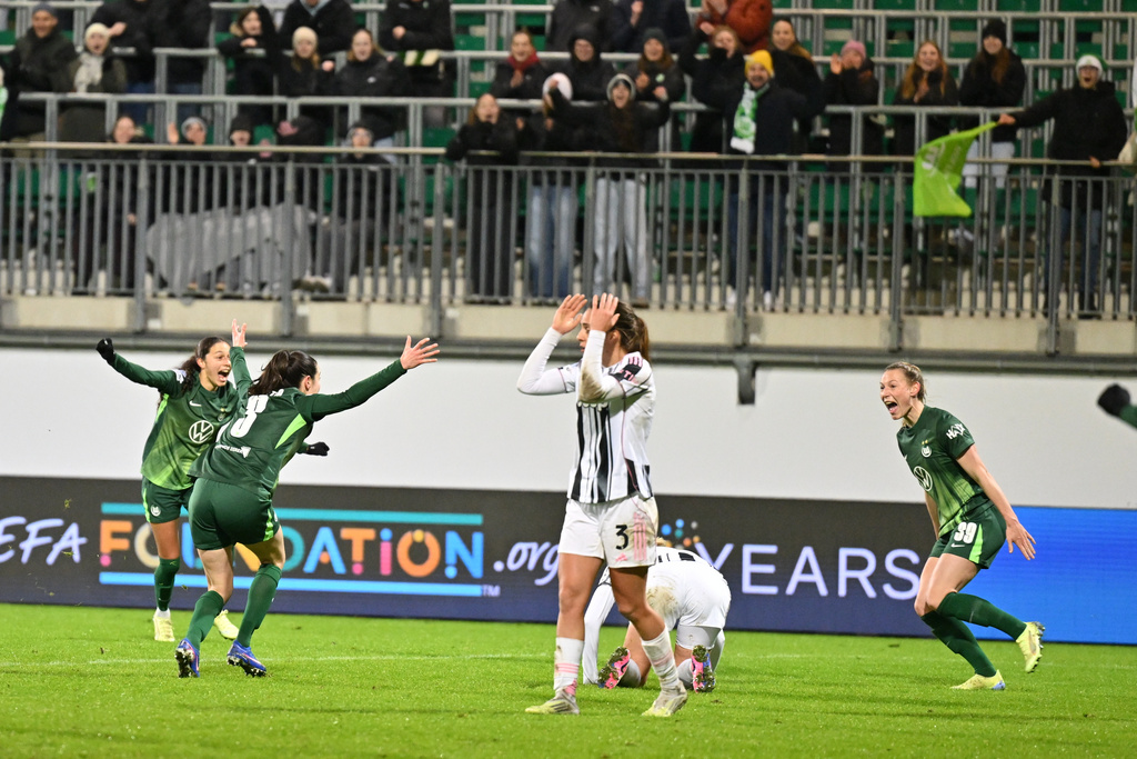 Wolfsburg's Sarai Linder right celebrates a goal during a women's Champions League soccer match between VfL Wolfsburg and Juventus FC, Thursday, Feb. 12, 2026, in Wolfsburg, Germany. (Swen Pförtner/dpa via AP)
