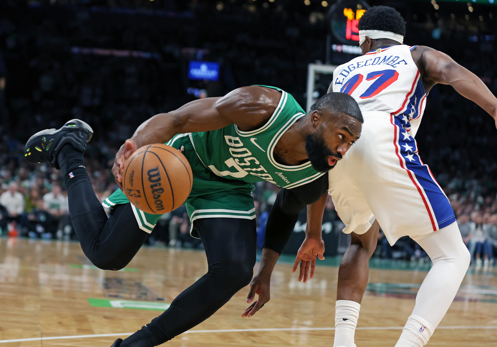 Boston Celtics' Jaylen Brown drives past the Philadelphia 76ers' VJ Edgecombe during the first half of Game 7 in a first-round NBA basketball playoffs series, Saturday, May 2, 2026 in Boston. (AP Photo/Jim Davis)