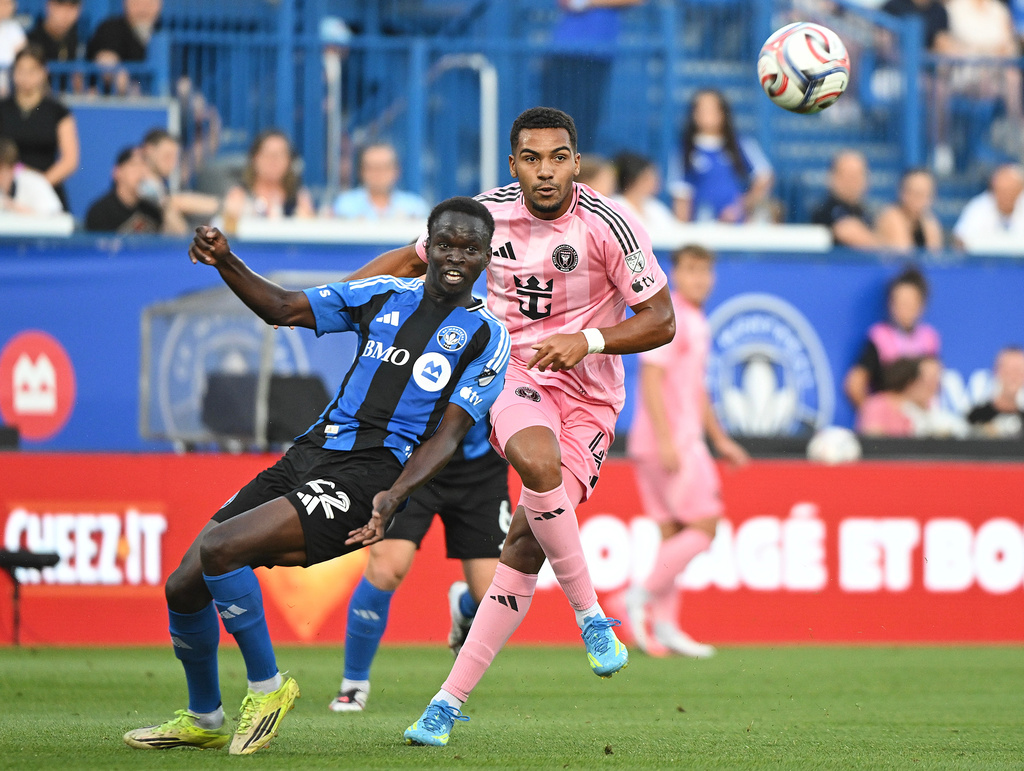 Inter Miami CF's Yannick Bright (42) defends against CF Montreal's Victor Loturi (22) during first half MLS soccer action in Montreal, on Saturday, July 25, 2026. (Graham Hughes/The Canadian Press via AP)