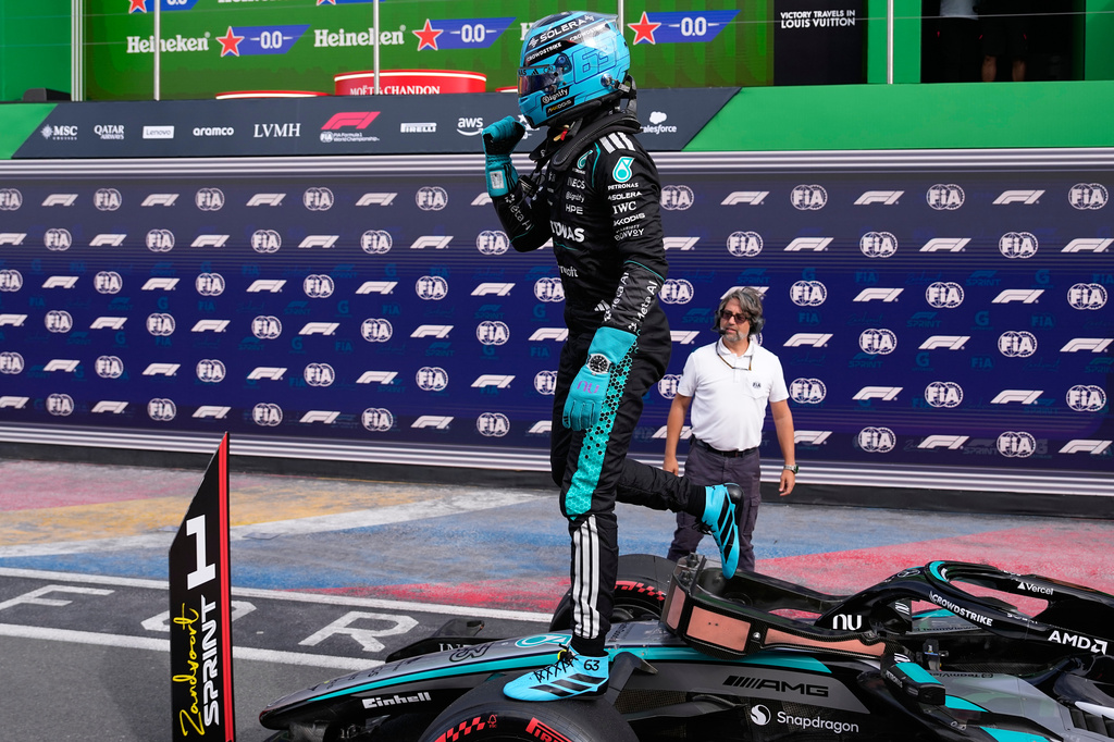 Mercedes driver George Russell of Britain reacts after taking pole position after the sprint qualifying for the Formula One Dutch Grand Prix in Zandvoort , Netherlands, Friday, Aug. 21, 2026. (AP Photo/Darko Bandic)