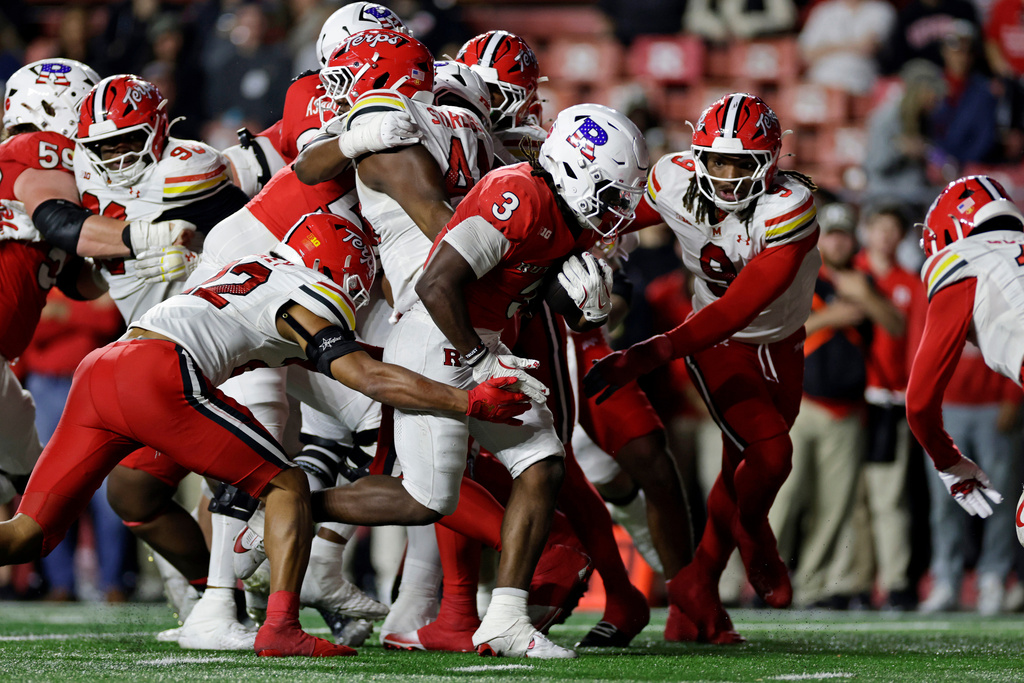 Rutgers running back Antwan Raymond (3) carries the ball for a touchdown past Maryland defensive lineman Zahir Mathis (9) during the second half of an NCAA college football game Saturday, Nov. 8, 2025, in Piscataway, N.J. (AP Photo/Adam Hunger)