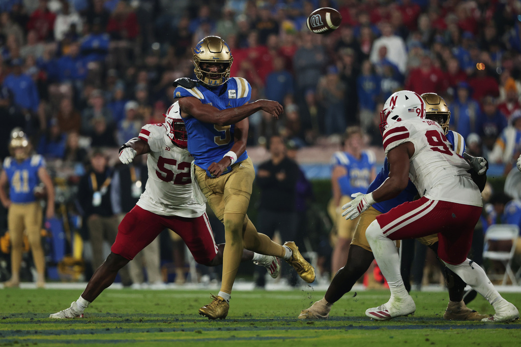 UCLA quarterback Nico Iamaleava (9) passes the ball during the first half of an NCAA college football game against Nebraska, Saturday, Nov. 8, 2025, in Pasadena, Calif. (AP Photo/Ethan Swope)