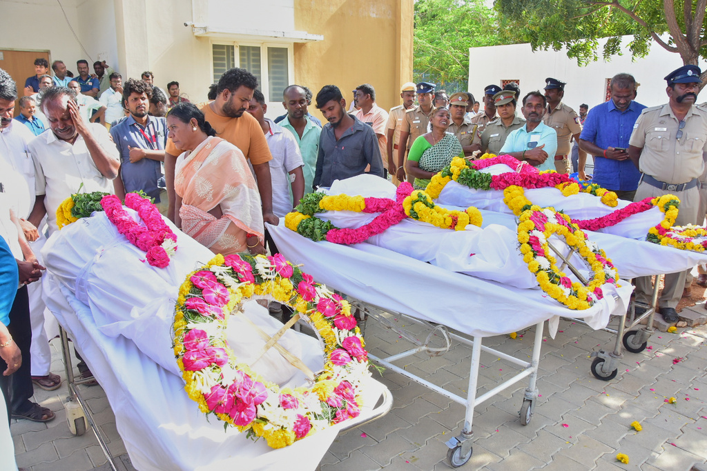 Relatives of people who were killed in a stampede during a rally for a popular Indian actor and politician, mourn as they take the bodies from a hospital, in Karur, in the southern state of Tamil Nadu, Sunday, Sept. 28, 2025. (AP Photo)