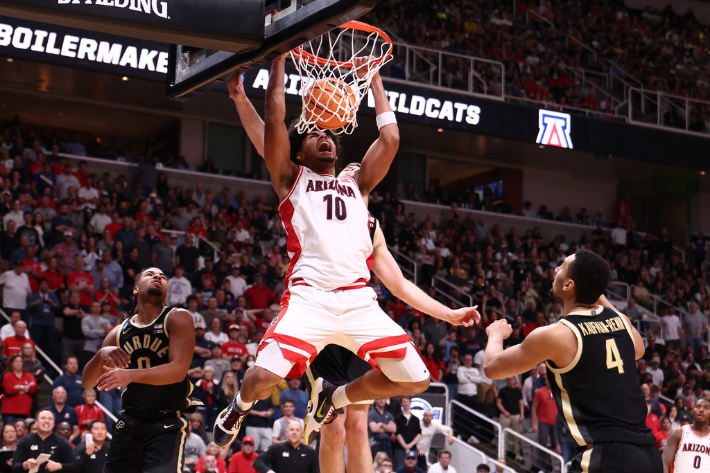 Arizona forward Koa Peat (10) dunks during the second half in the Elite Eight of the NCAA college basketball tournament against Purdue, Saturday, March 28, 2026, in San Jose, Calif. (AP Photo/Kelley L Cox)