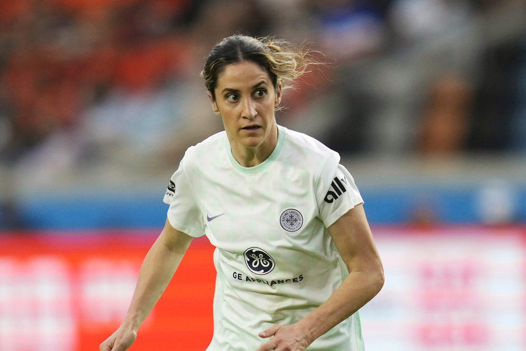 FILE - Racing Louisville FC midfielder Savannah DeMelo (7) looks for a pass against the Houston Dash during an NWSL soccer match, on March 26, 2023, in Houston. (AP Photo/Sam Craft, File)