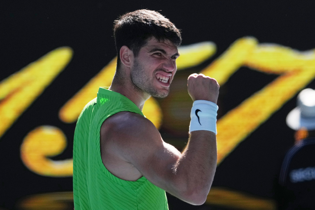 Carlos Alcaraz of Spain celebrates after defeating Yannick Hanfmann of Germany in their second round match at the Australian Open tennis championship in Melbourne, Australia, Wednesday, Jan. 21, 2026. (AP Photo/Dita Alangkara)