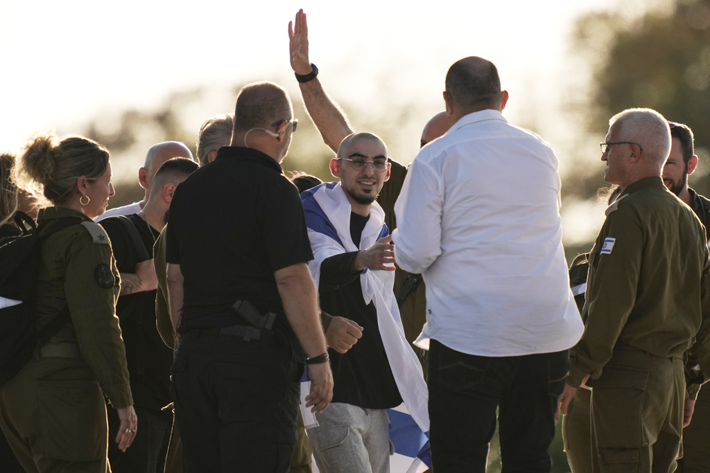 Rom Breslavski, an Israeli hostage released from the Gaza Strip walks off a helicopter at the Sheba Medical Center in Ramat Gan, Israel, Monday, Oct. 13, 2025. (AP Photo/Leo Correa)