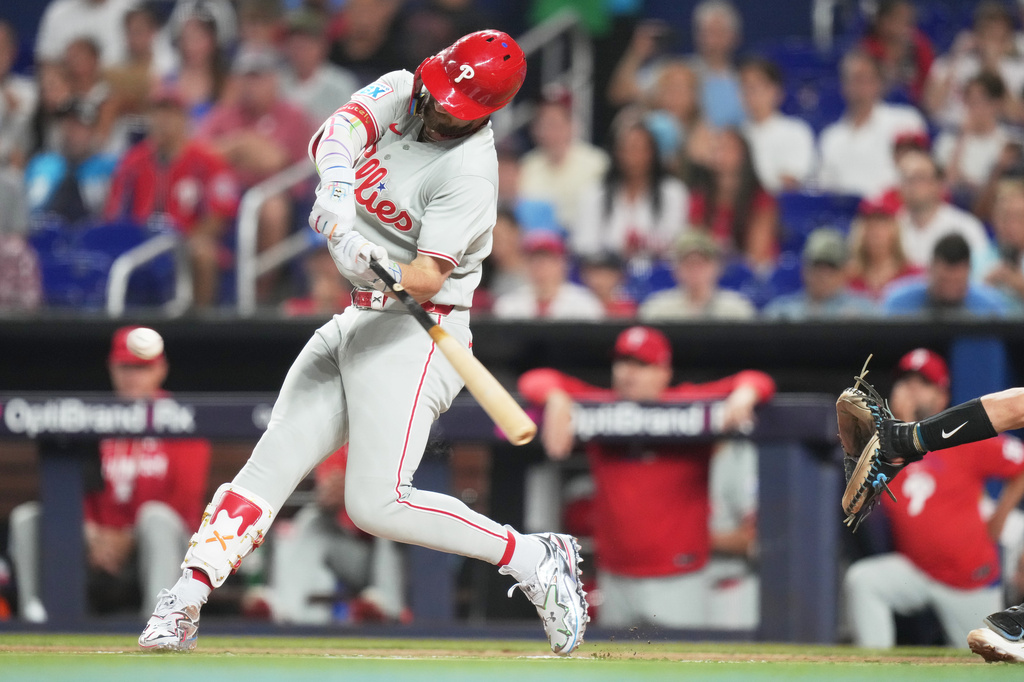 Philadelphia Phillies' Bryce Harper hits a two run home run during the first inning of a baseball game against the Miami Marlins, Monday, July 27, 2026, in Miami. (AP Photo/Lynne Sladky)