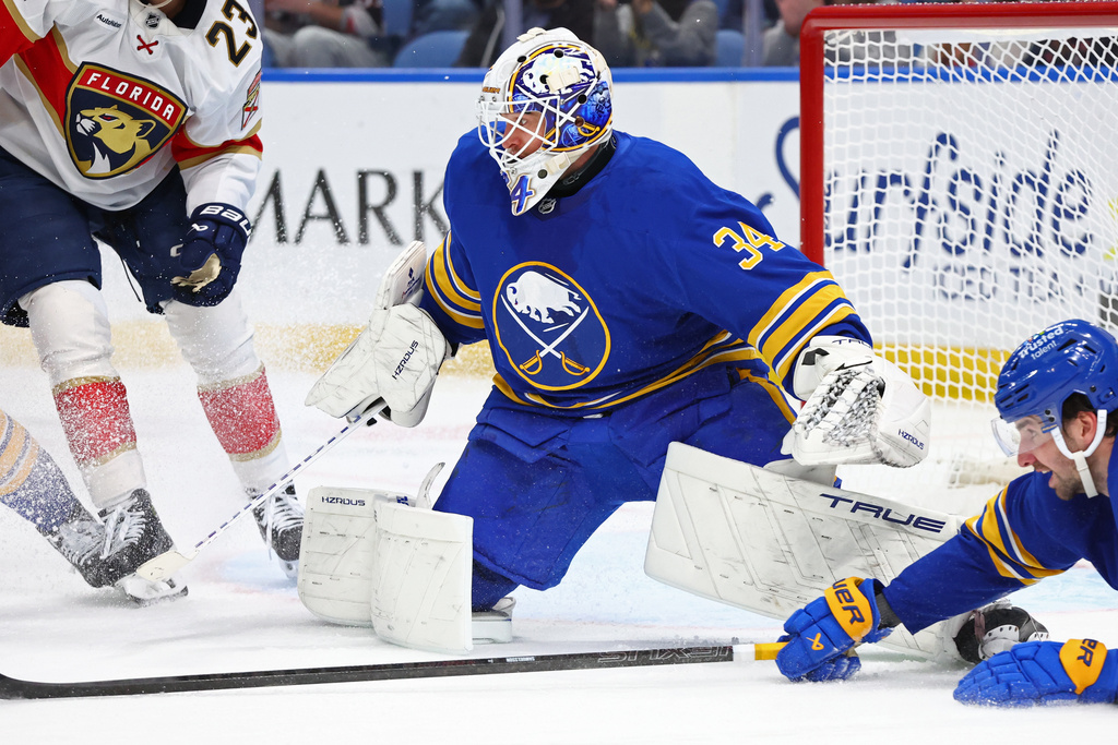 Buffalo Sabres goaltender Alex Lyon (34) watches the puck during the second period of an NHL hockey game against the Florida Panthers Saturday, Oct. 18, 2025, in Buffalo, N.Y. (AP Photo/Jeffrey T. Barnes)