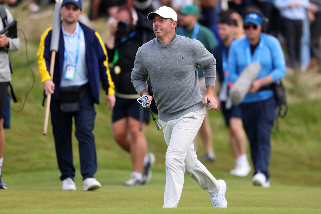 Rory McIlroyof Northern Ireland runs at the 18th hole during the Irish Open at Trump International Golf Links in Doonbeg, Ireland, Sunday, Sept. 13, 2026.(AP Photo/Peter Morrison)