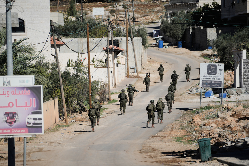 Israeli soldiers are seen during an army raid in the West Bank town of Tubas, Wednesday, Nov. 26, 2025. (AP Photo/Majdi Mohammed)