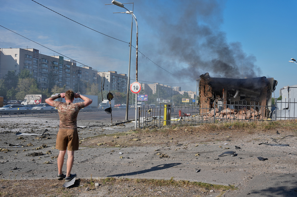 A civilian reacts after a gas station was hit by a Russian drone in Kyiv, Ukraine, Friday, Sept. 11, 2026. (AP Photo/Efrem Lukatsky)