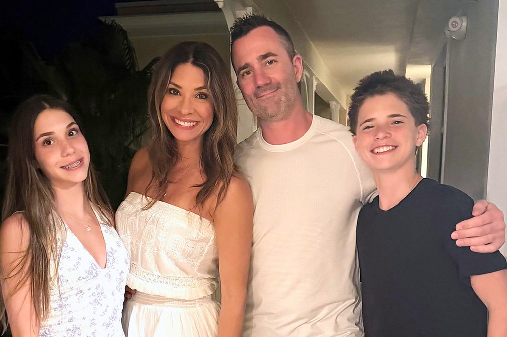 This undated photo released by the Toronto Police Service shows police officer Marc Pinizzotto posing with his family. Pinizzotto was shot and killed on Thursday, June 11, 2026, in Toronto. (Toronto Police Service via AP)