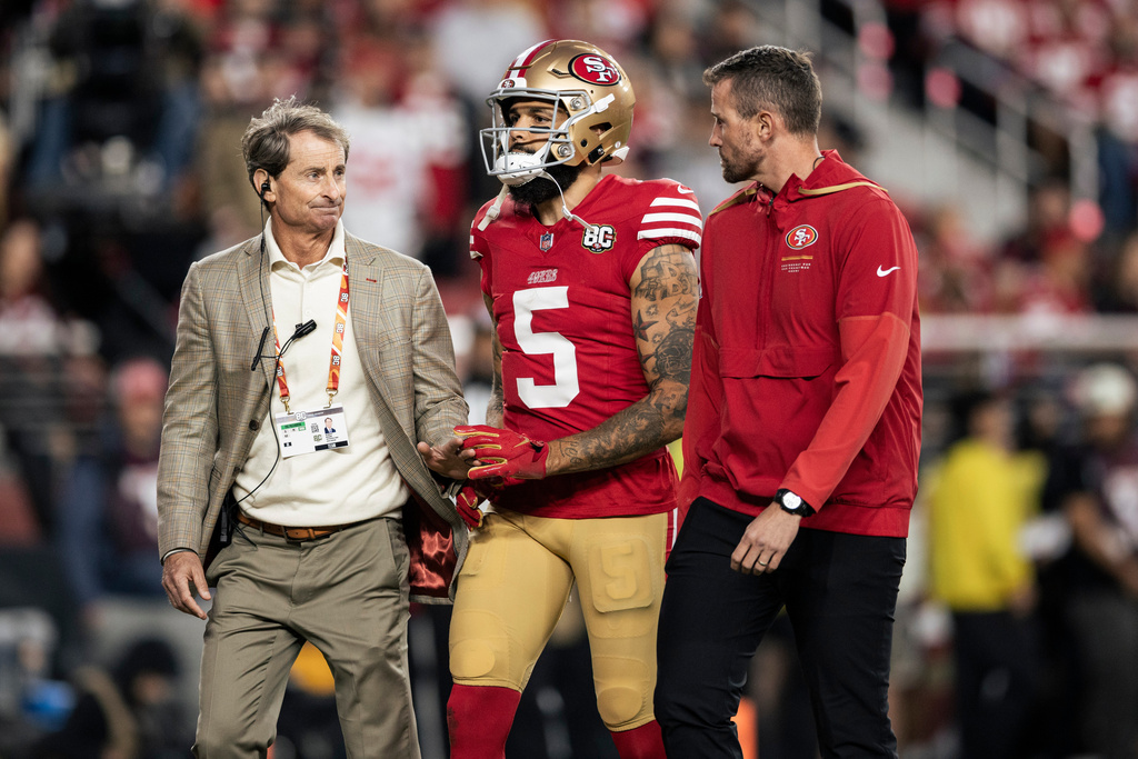 San Francisco 49ers wide receiver Mike Evans (5) walks to the locker room after he was injured in the second quarter of a NFL football game against the Washington Commanders in Santa Clara, Calif., Monday, Oct. 19, 2026. (Stephen Lam/San Francisco Chronicle via AP)