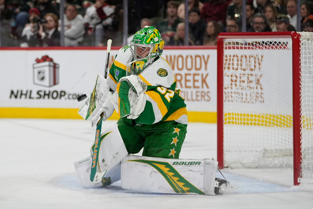 Minnesota Wild goaltender Filip Gustavsson (32) stops a shot during the second period of an NHL hockey game against the Washington Capitals, Tuesday, Dec. 16, 2025, in St. Paul, Minn. (AP Photo/Abbie Parr)