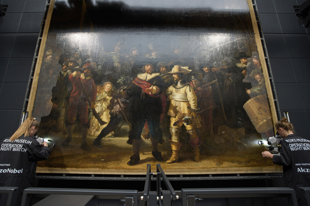 Art restorers work on Rembrandt's Night Watch at Amsterdam's Rijksmuseum, Netherlands, Tuesday, Sept. 23, 2025. (AP Photo/Peter Dejong)